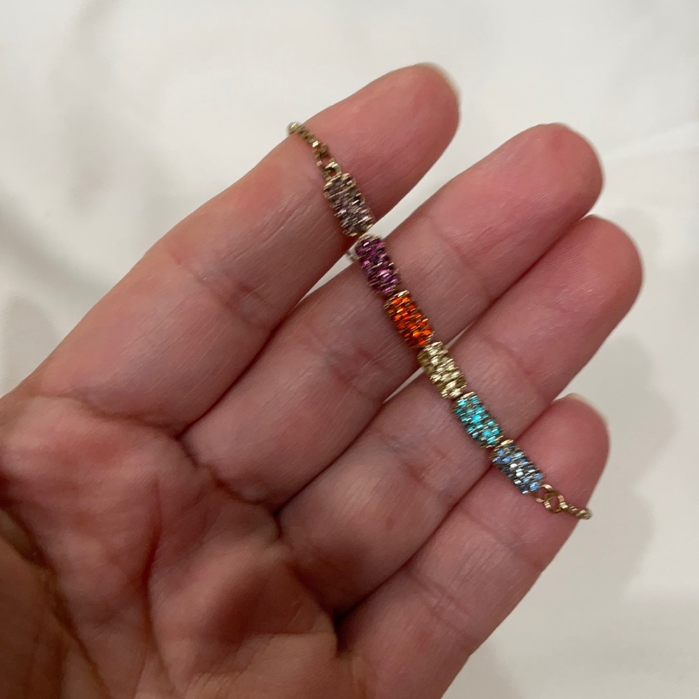 Adjustable gold colorful bracelet.